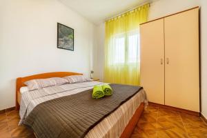 Postel nebo postele na pokoji v ubytování Apartments Marina
