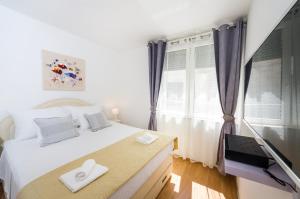 Postel nebo postele na pokoji v ubytování Apartman Lara