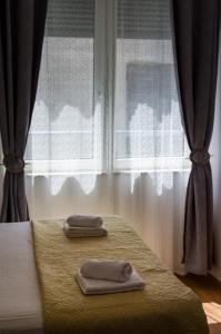 Postel nebo postele na pokoji v ubytování Apartman Lara