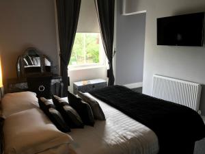 Voodi või voodid majutusasutuse Chapel Cross Guesthouse toas