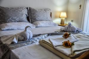 Postel nebo postele na pokoji v ubytování Apartments Croma