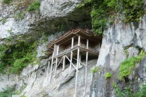 a building on the side of a mountain at Hotel St Palace Kurayoshi in Kurayoshi