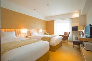 Tempat tidur dalam kamar di Hotel Nikko Kansai Airport - 3 mins walk to the airport