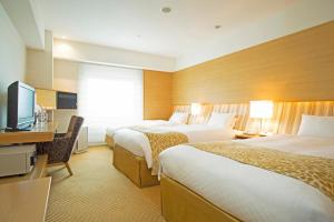 Un pat sau paturi într-o cameră la Hotel Nikko Kansai Airport - 3 mins walk to the airport