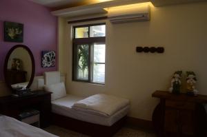 Postel nebo postele na pokoji v ubytování Jia Yuan Homestay