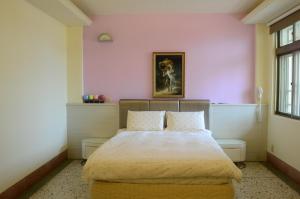 Postel nebo postele na pokoji v ubytování Jia Yuan Homestay