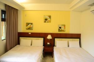 Postel nebo postele na pokoji v ubytování Jia Yuan Homestay