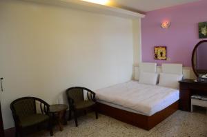 Postel nebo postele na pokoji v ubytování Jia Yuan Homestay
