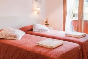 Postel nebo postele na pokoji v ubytování Hotel Le Rotonde