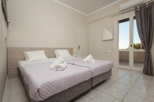 Ένα ή περισσότερα κρεβάτια σε δωμάτιο στο Popy's Place