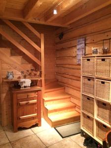 a sauna with wooden walls and stairs in a cabin at La Grange De L'Errance in Giron