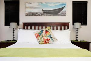Säng eller sängar i ett rum på Aloes No.21