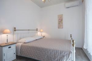 Posteľ alebo postele v izbe v ubytovaní Olive Tree House in Parikia