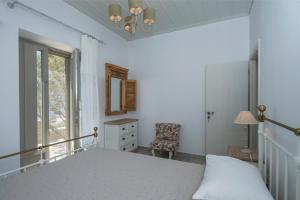 Posteľ alebo postele v izbe v ubytovaní Olive Tree House in Parikia