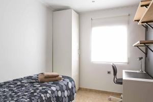 Posteľ alebo postele v izbe v ubytovaní Attic Valencia Beach