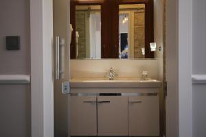a bathroom with a sink and a mirror at Hotel Naumpasa Konagi in Istanbul +54 photos