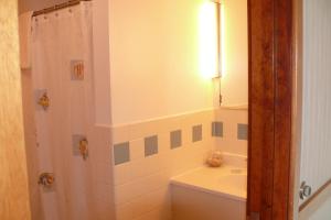 a bathroom with a white toilet sitting next to a bath tub at Sea Drift Motel in Old Orchard Beach