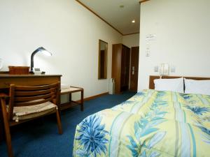 En eller flere senge i et værelse på Hotel Trend Saijo