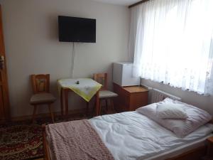 Łóżko lub łóżka w pokoju w obiekcie Lenadia