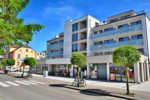 a white building with bikes parked in front of it at DW Koral in Niechorze