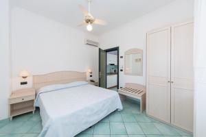 Кровать или кровати в номере La Residenza Aparthotel