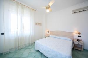 Кровать или кровати в номере La Residenza Aparthotel