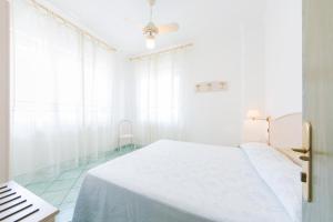 Кровать или кровати в номере La Residenza Aparthotel