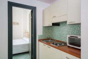 Кухня или мини-кухня в La Residenza Aparthotel
