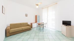 Телевизор и/или развлекательный центр в La Residenza Aparthotel