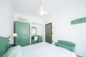 Кровать или кровати в номере La Residenza Aparthotel