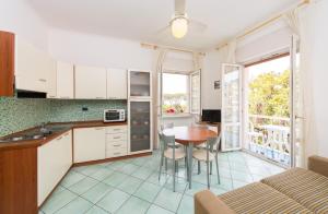 Кухня или мини-кухня в La Residenza Aparthotel

