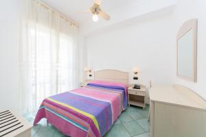 Кровать или кровати в номере La Residenza Aparthotel