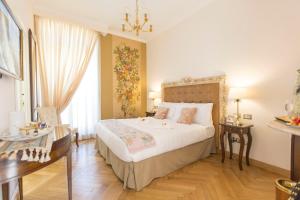 Cama ou camas em um quarto em Royal Suite Trinità Dei Monti