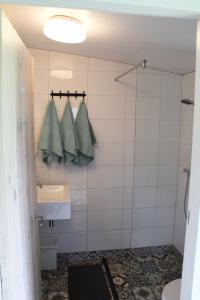 a bathroom with a sink and a shower at Bed and Stay Amsterdam in Amsterdam