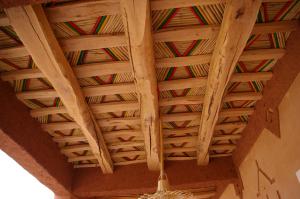 a ceiling of a room with a wooden ceiling at Auberge Des Jardins du Dades in Boumalne