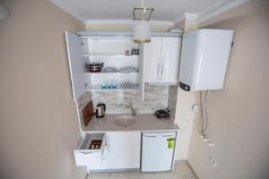 Una cocina o cocineta en Senturkler Suite