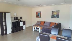 a living room with a couch and a table at Apartments Spas in Budva