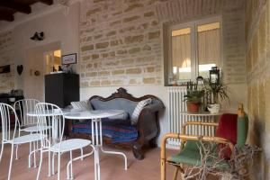 a room with a table and some chairs and a table and a table and chairs at D'AGO48 in Ancona