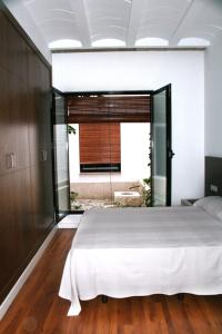 Posteľ alebo postele v izbe v ubytovaní Apartamentos Coronado