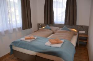 Postel nebo postele na pokoji v ubytování Apartment Haus Van der Leij