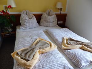 Ein Bett oder Betten in einem Zimmer der Unterkunft Hotel Dorotheenhof