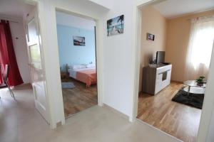 Posteľ alebo postele v izbe v ubytovaní Apartman Seaside Paradise