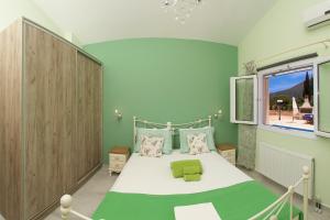 a bedroom with a bed and a large window at Country Style Villa Christina in Pouláta +130 photos
