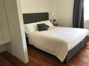 A bed or beds in a room at Corte di Pellio