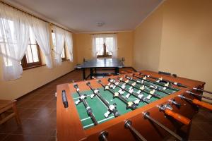 a conference room with a table in the middle at Apartamenty przy basenie blisko morza Brown in Puck
