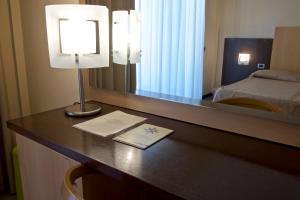 Postel nebo postele na pokoji v ubytování Albergo Mediterraneo
