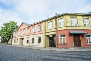 a building on the side of a street at Karja Castle Apartments in Haapsalu