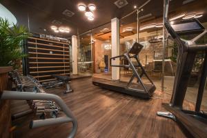 a gym with a treadmill and exercise equipment at Hotel Forza Terra in Kotor