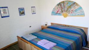 Posteľ alebo postele v izbe v ubytovaní B&B Pani Silvio