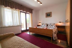 Postel nebo postele na pokoji v ubytování Zelena oaza Apartment